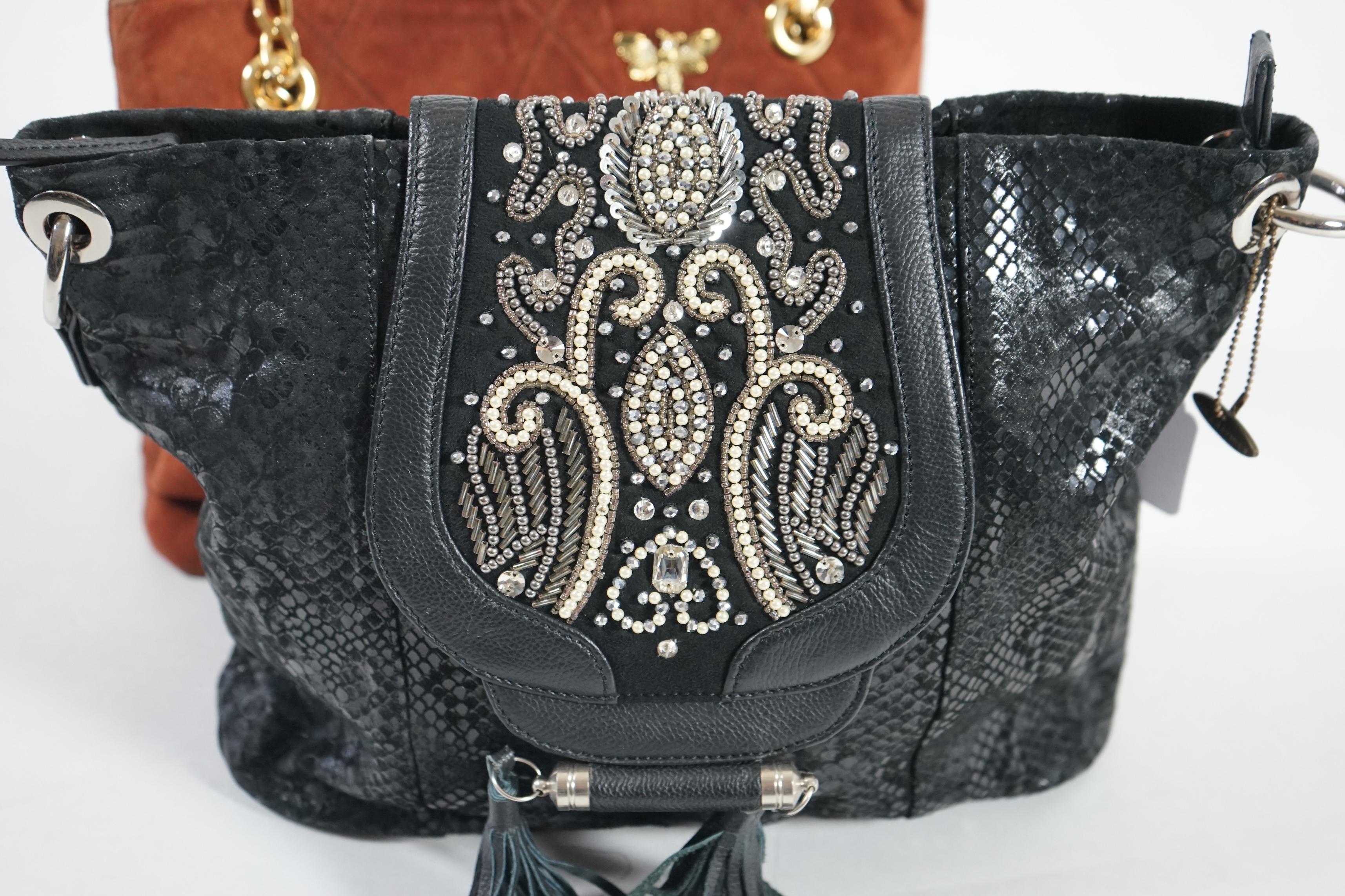 A selection of lady's handbags including a VERY Valentino black canvas bag with gold decorated chain handles, a Mary Frances black suede faux snake skin print shoulder bag with embellished fastening, a tan suede shoulder